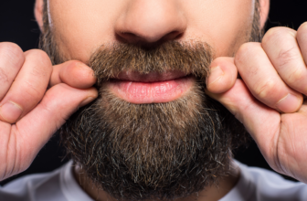 man grooming beard oil beard